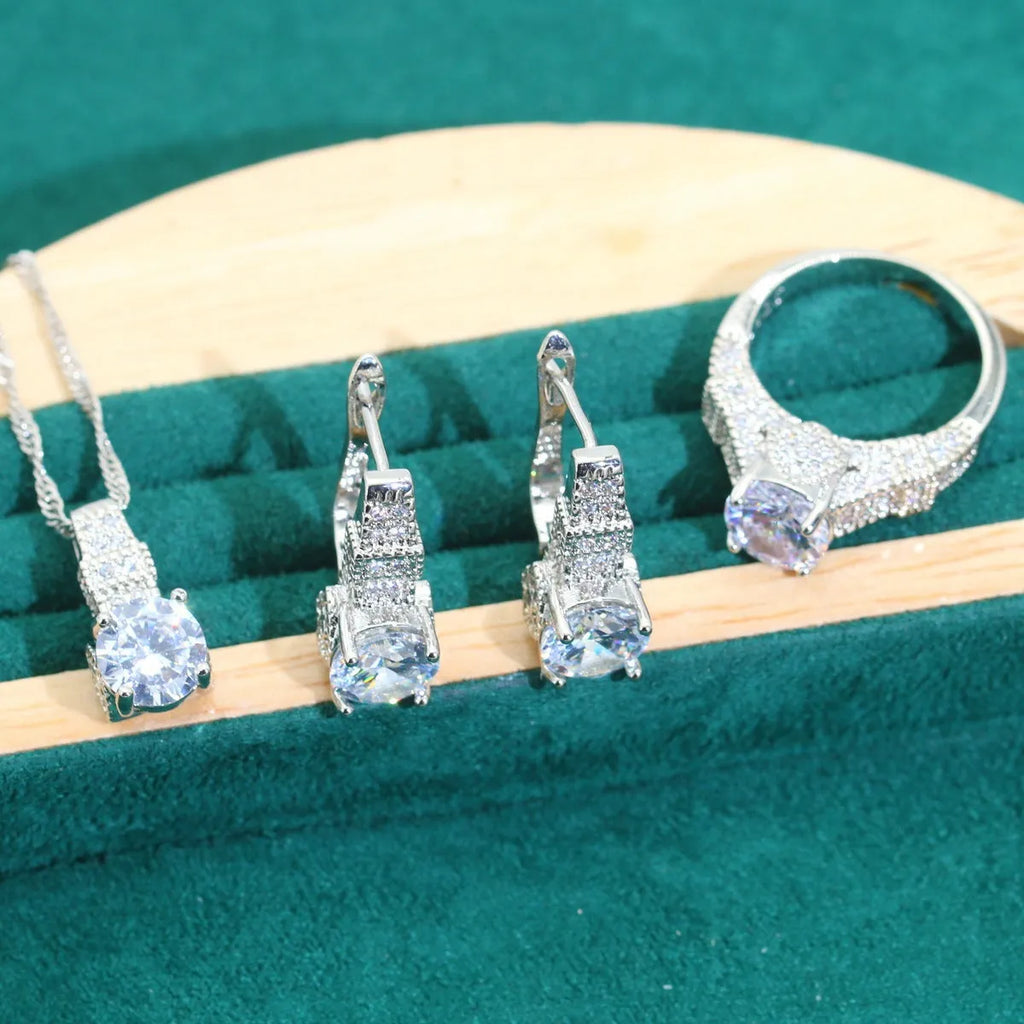 Four-piece bridal jewellery set with zircon details, water wave chains, and alloy pendants in presentation