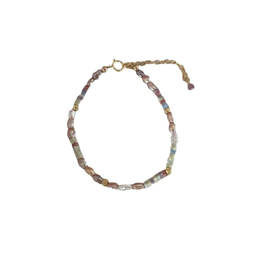 Women's natural pearl and silver bracelet and necklace set with U-shaped design and irregular format