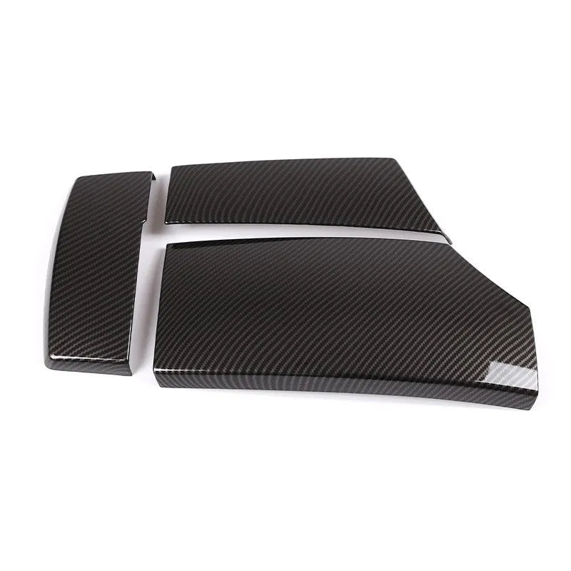 Three black ABS car armrest protective covers with a shiny diagonal carbon fibre weave pattern.