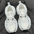 Beige mesh platform sports shoes with wedge heel, front lace-up design, and rubber sole