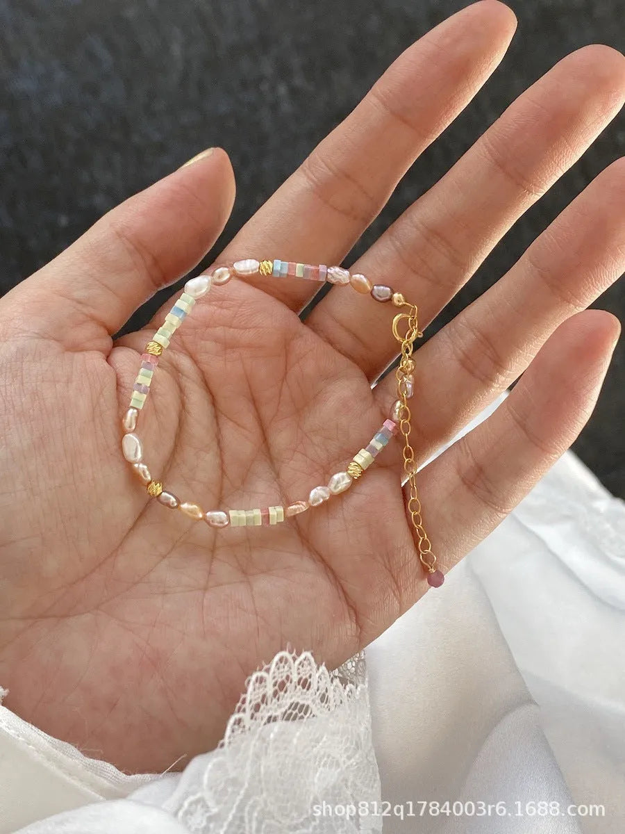 Women's natural pearl and silver bracelet and necklace set with U-shaped design and irregular format