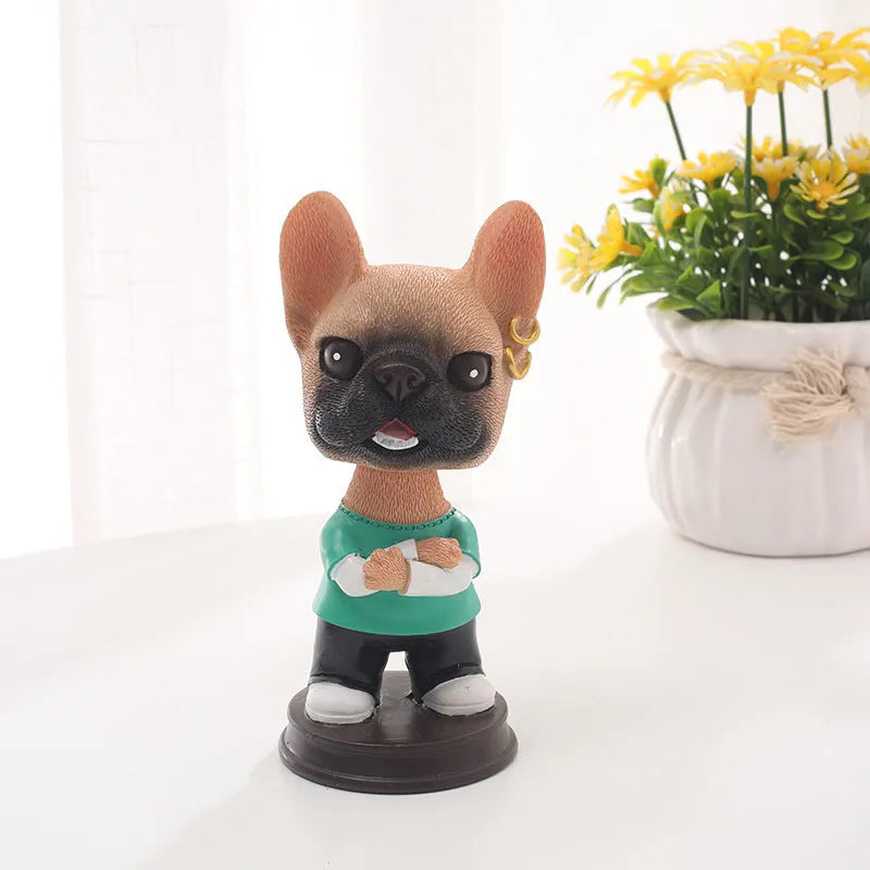 Resin dog car ornament with shaking head, 12cm, in bones style on a car dashboard