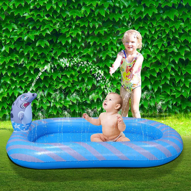 Blue dinosaur inflatable water spray pool with pet play mat and shark toy in garden setting
