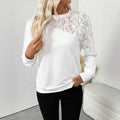 White long sleeve pullover top with floral pattern showing loose fit and regular sleeve design