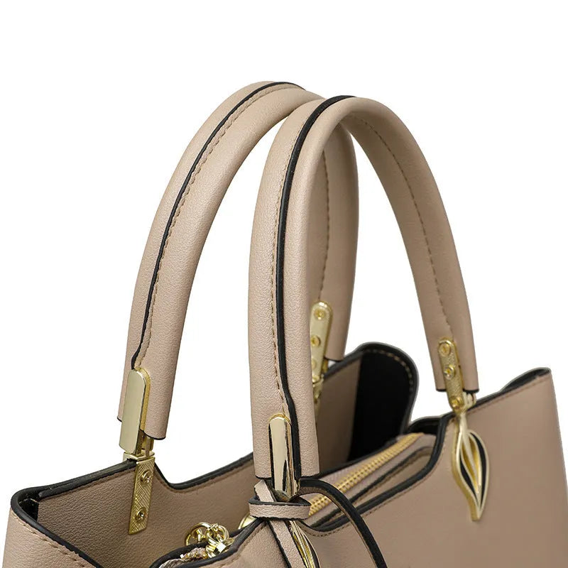 Women's black PU leather messenger bag with shoulder strap and sewing thread detail.