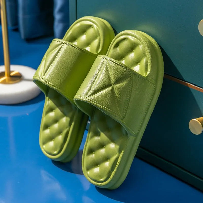 Pair of thick-sole EVA bathroom sandals in a chosen colour, showing soft upper and substantial non-slip base.