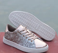 Women's black sequinned lace-up casual shoes with a round toe and rubber sole, shown from the side.