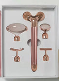 Rose gold five-in-one vibrating face massager with jade roller, disc, U-shaped and T-shaped beauty heads in colour box