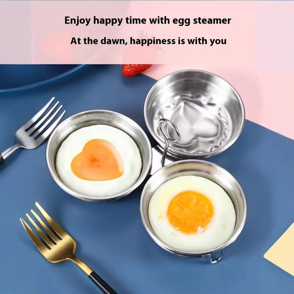 Mini stainless steel egg steamer in heart-shaped and round designs on a kitchen counter.