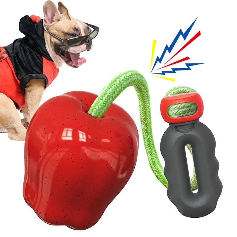 Green and red plastic Apple-shaped dog toy with a slot for dog food and a squeaker inside.