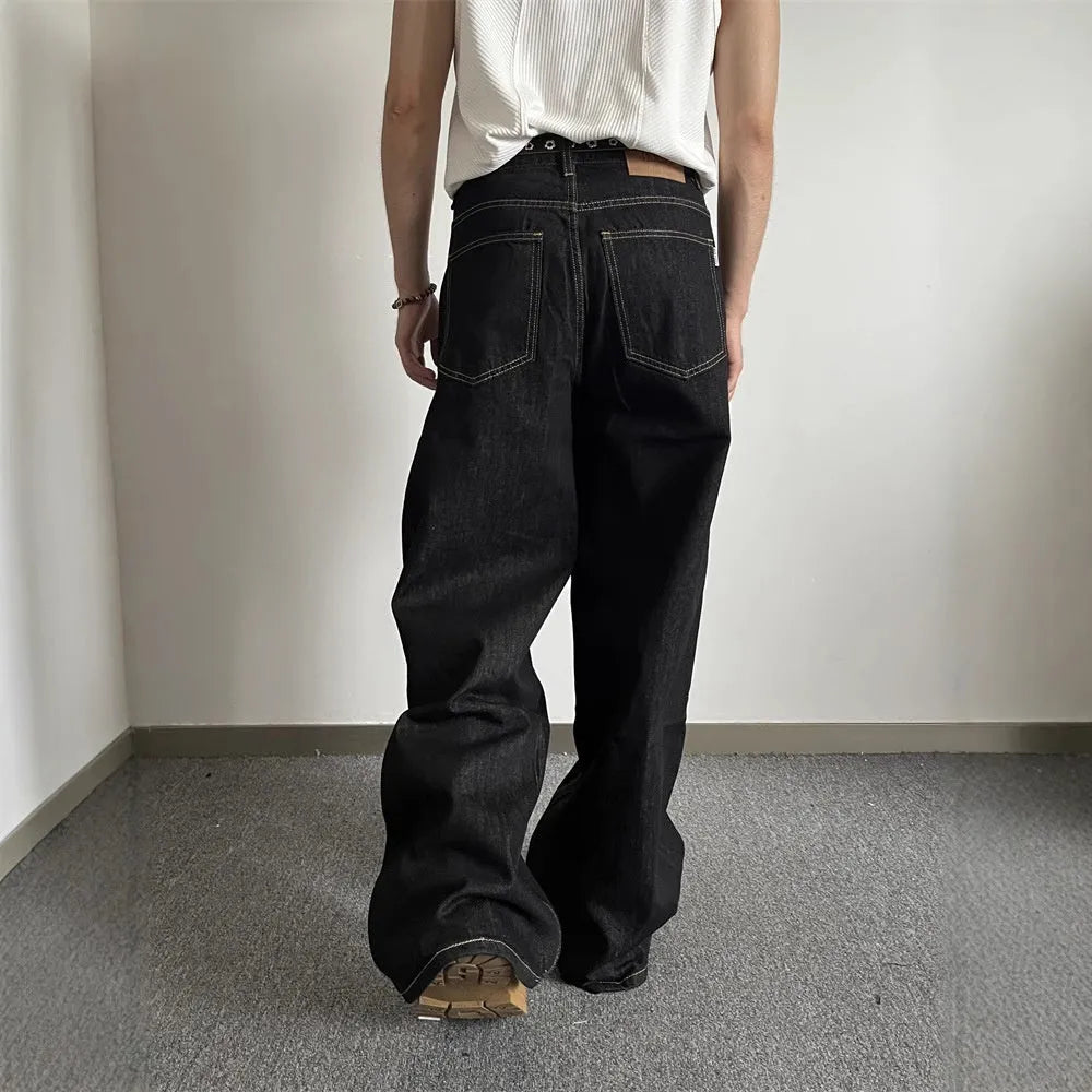 Black retro wide-leg denim jeans with straight-leg design and zip placket
