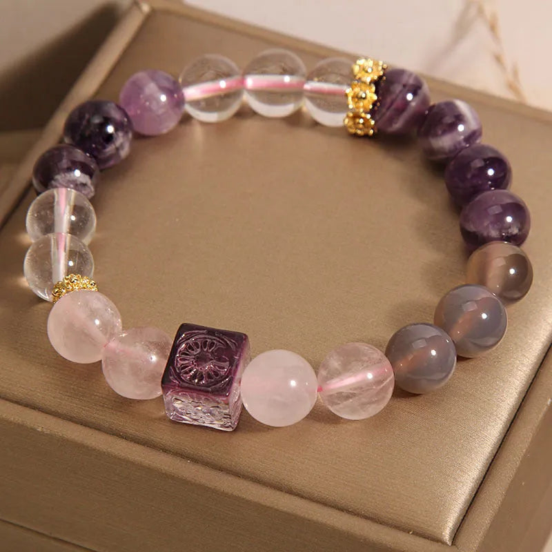 Purple natural amethyst crystal bracelet with rhinestone elements on adjustable band