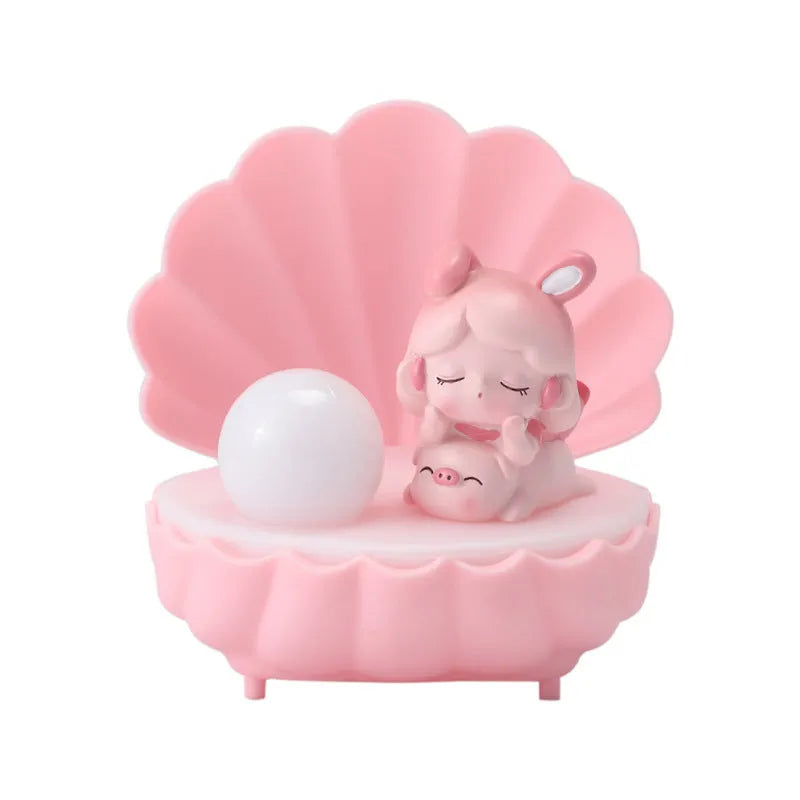 Cartoon character resin night light with shell star design on tabletop
