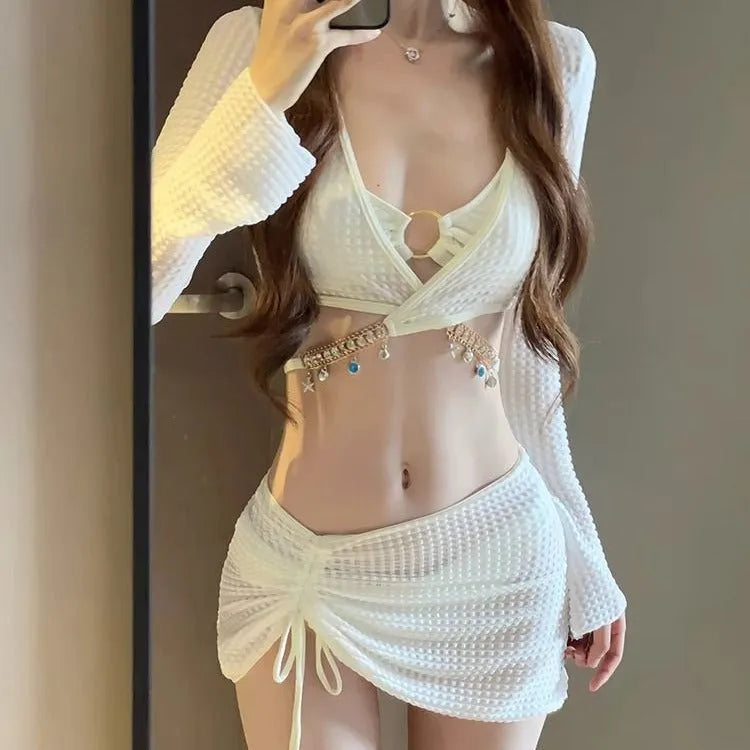 Women's black long sleeve bikini swimsuit made from polyester fabric for swimming.
