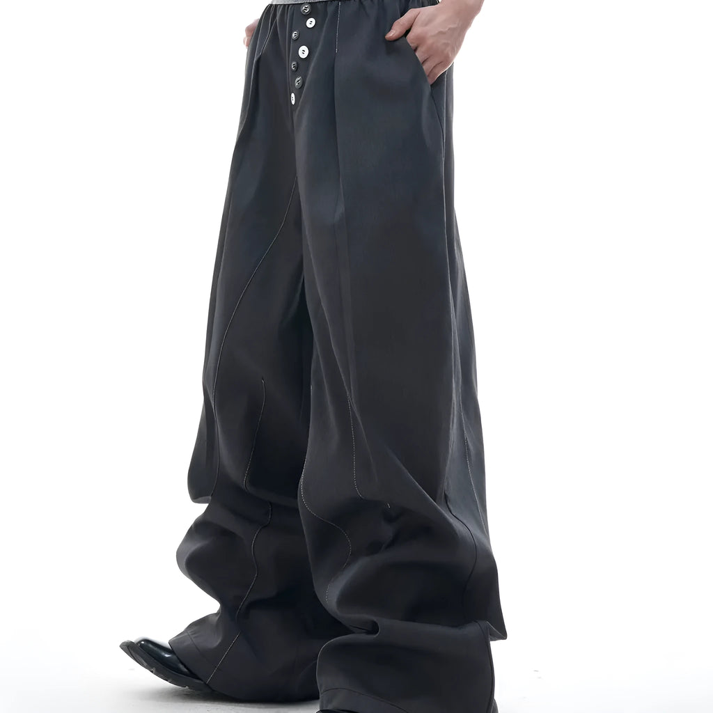 A pair of high-waisted straight-leg casual trousers in a black polyester-cotton blend with a button fly and open hem.