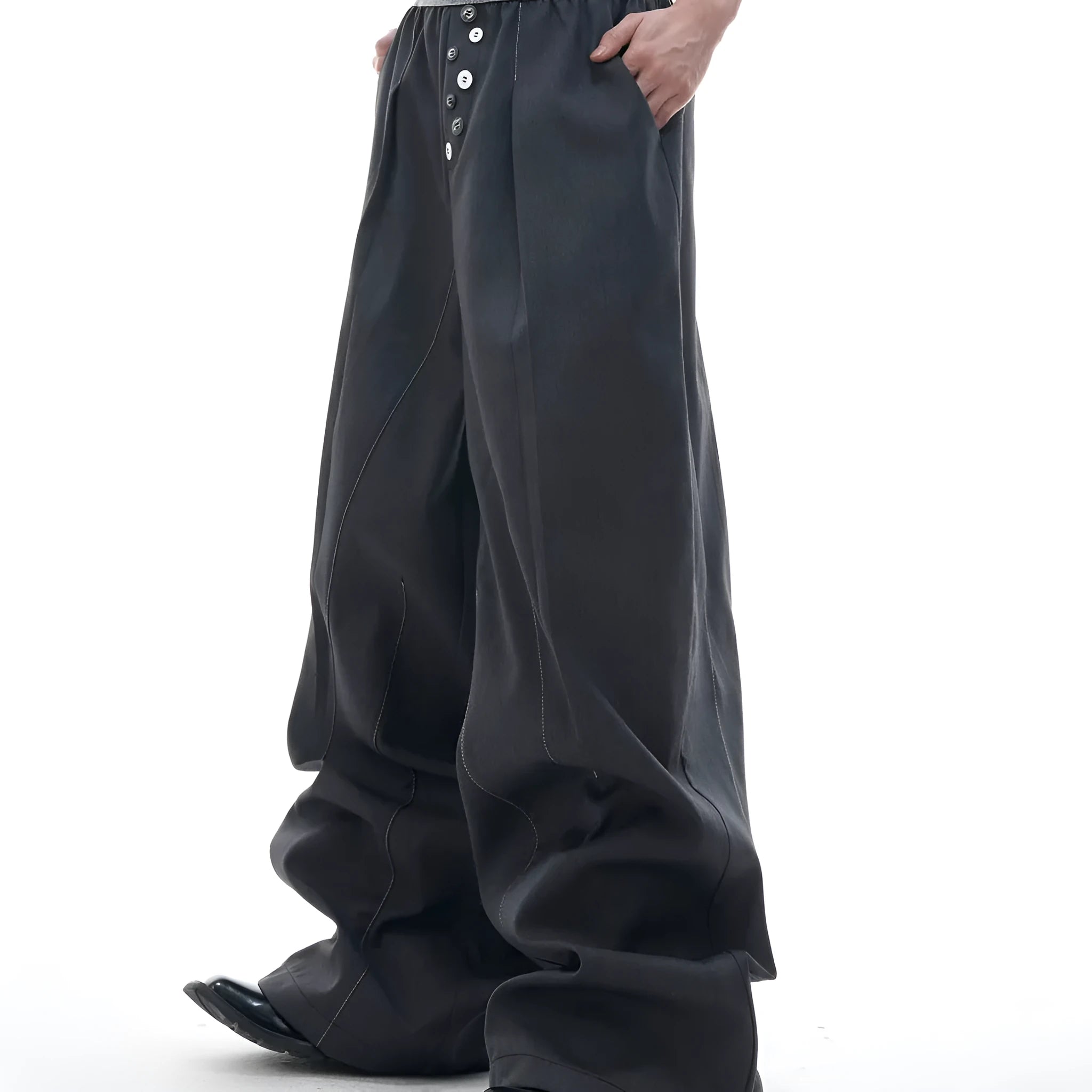 A pair of high-waisted straight-leg casual trousers in a black polyester-cotton blend with a button fly and open hem.