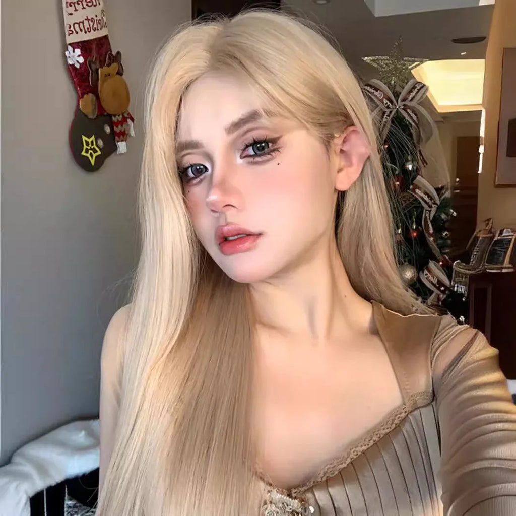 Long straight milk tea blonde synthetic wig on a stand with hair net