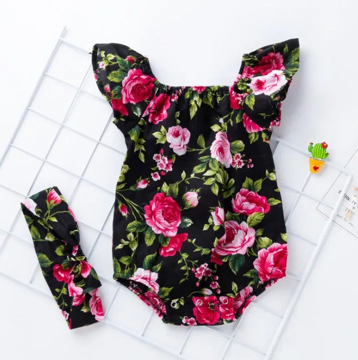 Black and white cotton baby girl romper with small flying sleeves and baby prints