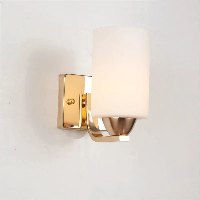 Modern chrome-finished wall lamp with a glass shade, shown in single-head and double-head configurations.