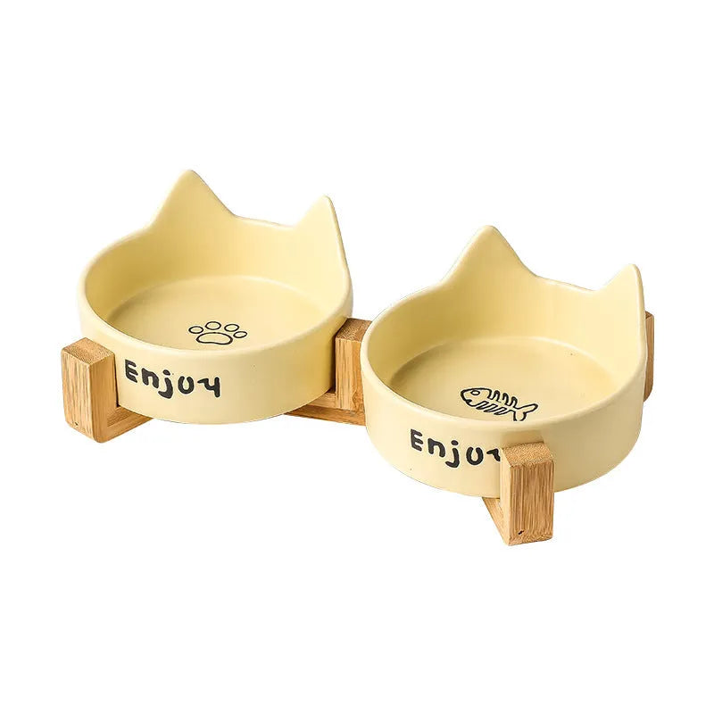 Porcelain cat food and water bowl set with wooden anti-slide frame in a choice of colours and patterns.