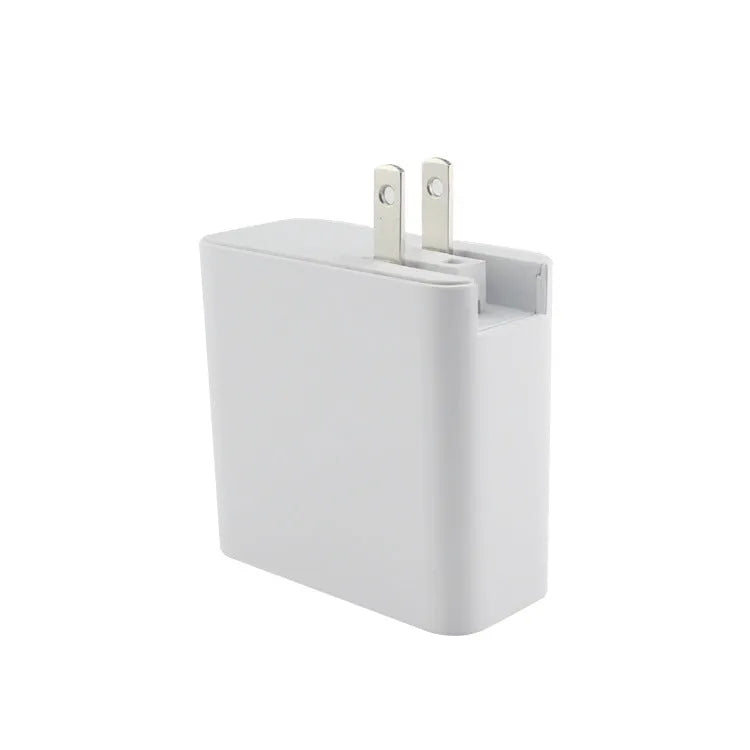 Black and white four-port USB-C wall charger with UK, US, EU, and AU plug options.
