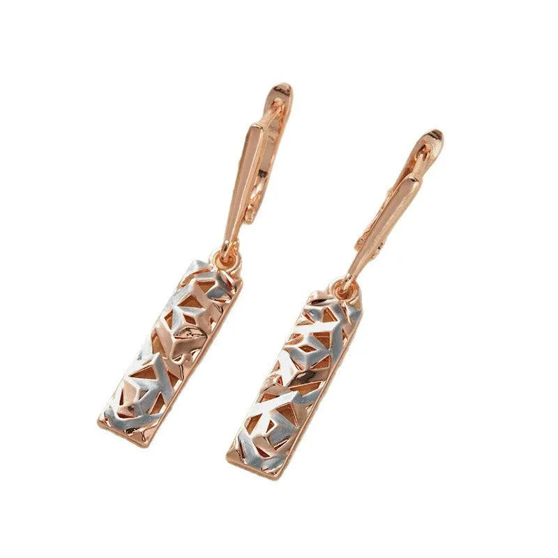 Rectangular two-tone hollow alloy stud earrings for women with electroplated finish.