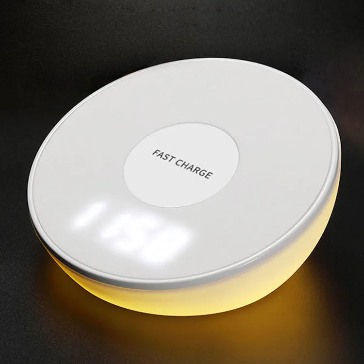White wireless charger with clock display and three control buttons for smartphone charging