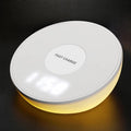 White wireless charger with clock display and three control buttons for smartphone charging