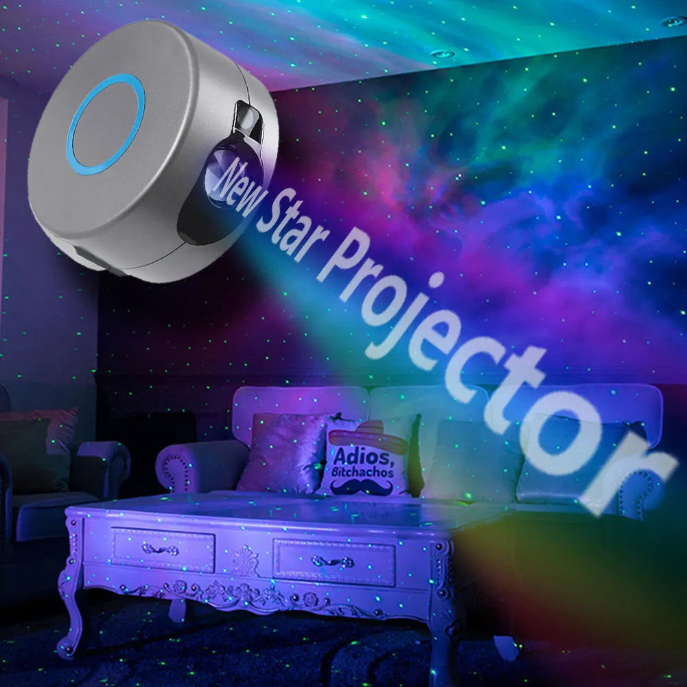 Grey starry sky projection lamp with remote control on a table, projecting colourful light dots on a dark wall.