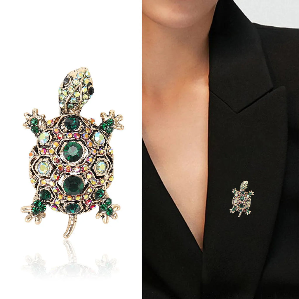 Retro-style alloy turtle brooch with rhinestone decoration, shown in blue colour.