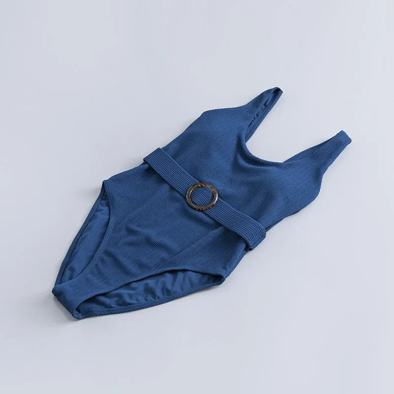 Navy blue women's one-piece swimsuit with triangle neckline and chest pads