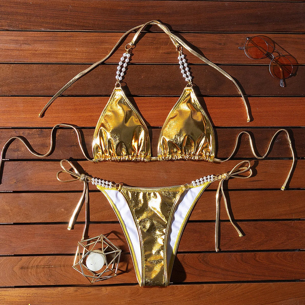Gold halter lace-up bikini with pearl chain detail and briefs-style bottoms