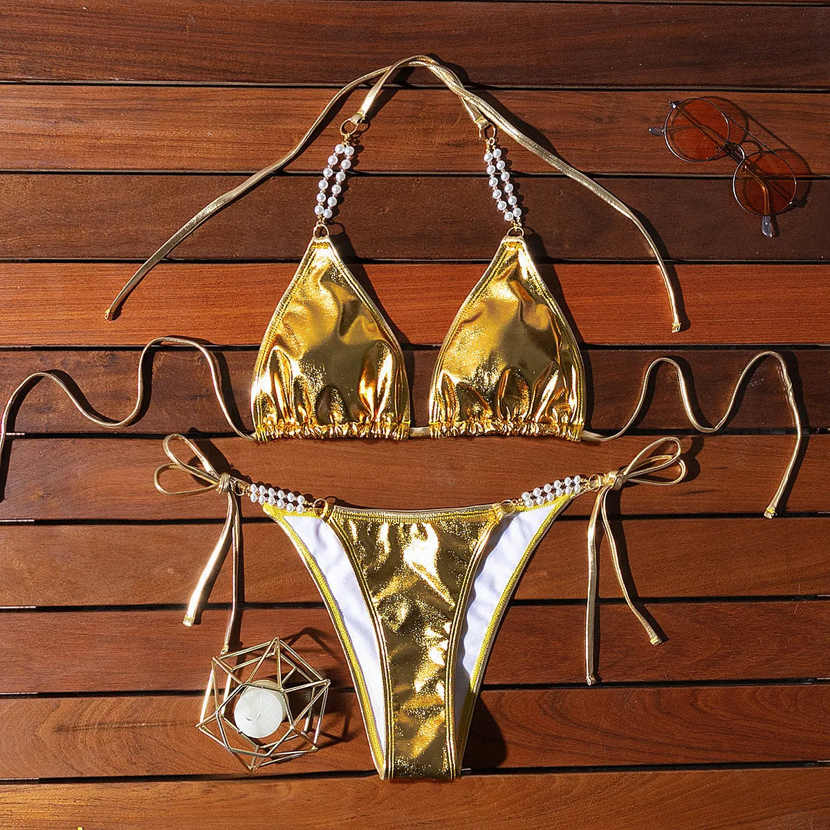 Gold halter lace-up bikini with pearl chain detail and briefs-style bottoms