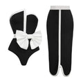 Women's black and white colour-block one-piece swimsuit with bow detail and tube top neckline