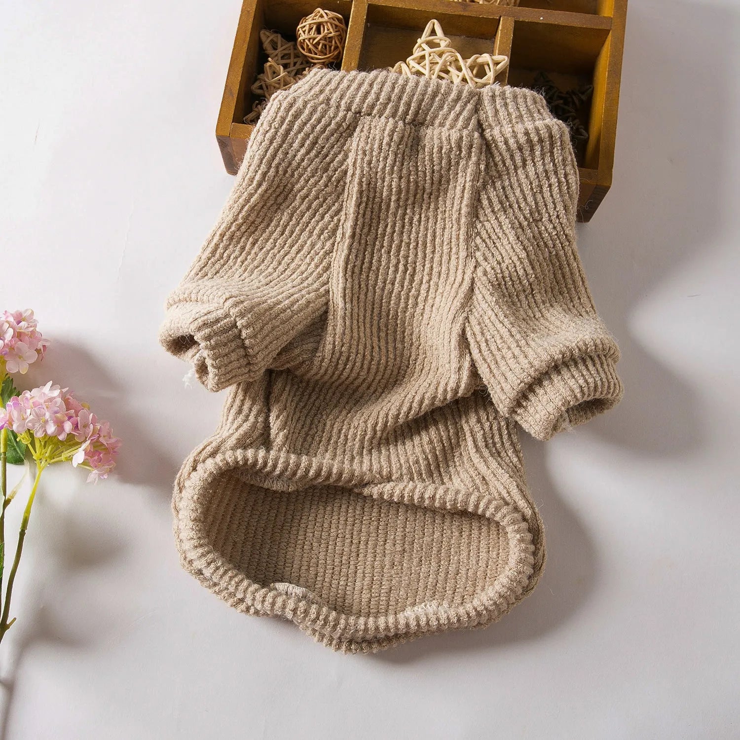 Brown cloth pullover sweater on a small dog, showing casual design and comfortable fit.