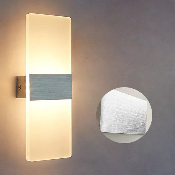 Modern wall-mounted LED bedside lamp with acrylic shade in silver finish