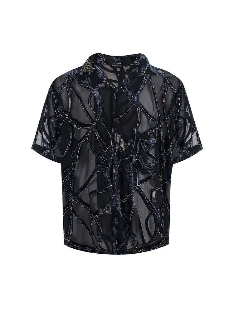Man wearing a black and grey snake pattern short-sleeved translucent polyester shirt with a loose fit.