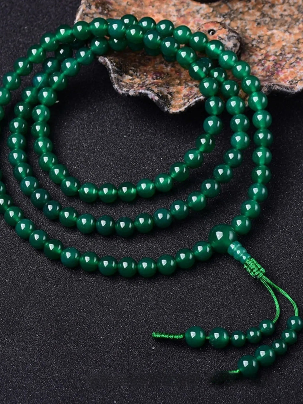 Natural green agate 108 bead bracelet with thangka pendant, worn as a multi-loop unisex accessory.