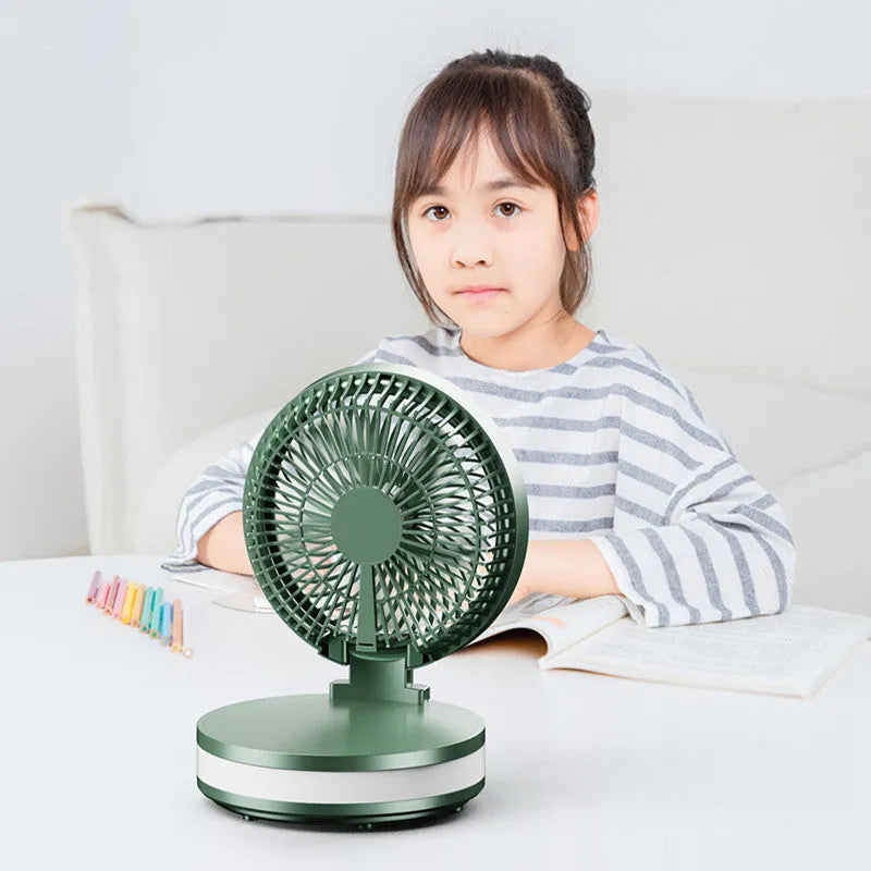Portable 7-inch rechargeable folding desk fan with LED lamp and aromatherapy, white colour, placed on a table