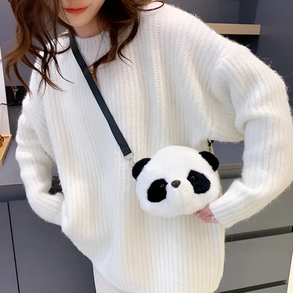 Soft plush panda head crossbody bag with cylindrical shape and outer pocket.