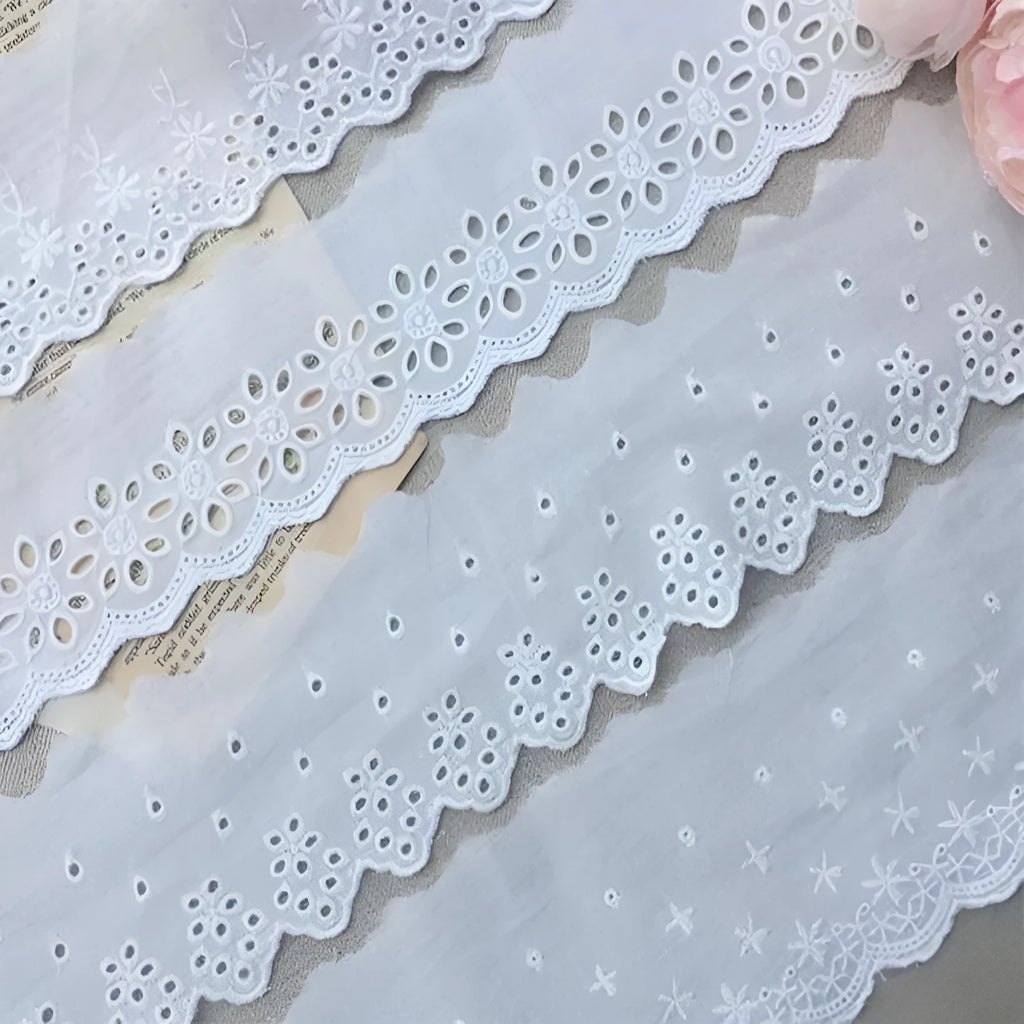 Cotton embroidered lace cutout trim roll showing four different width options for DIY clothing projects
