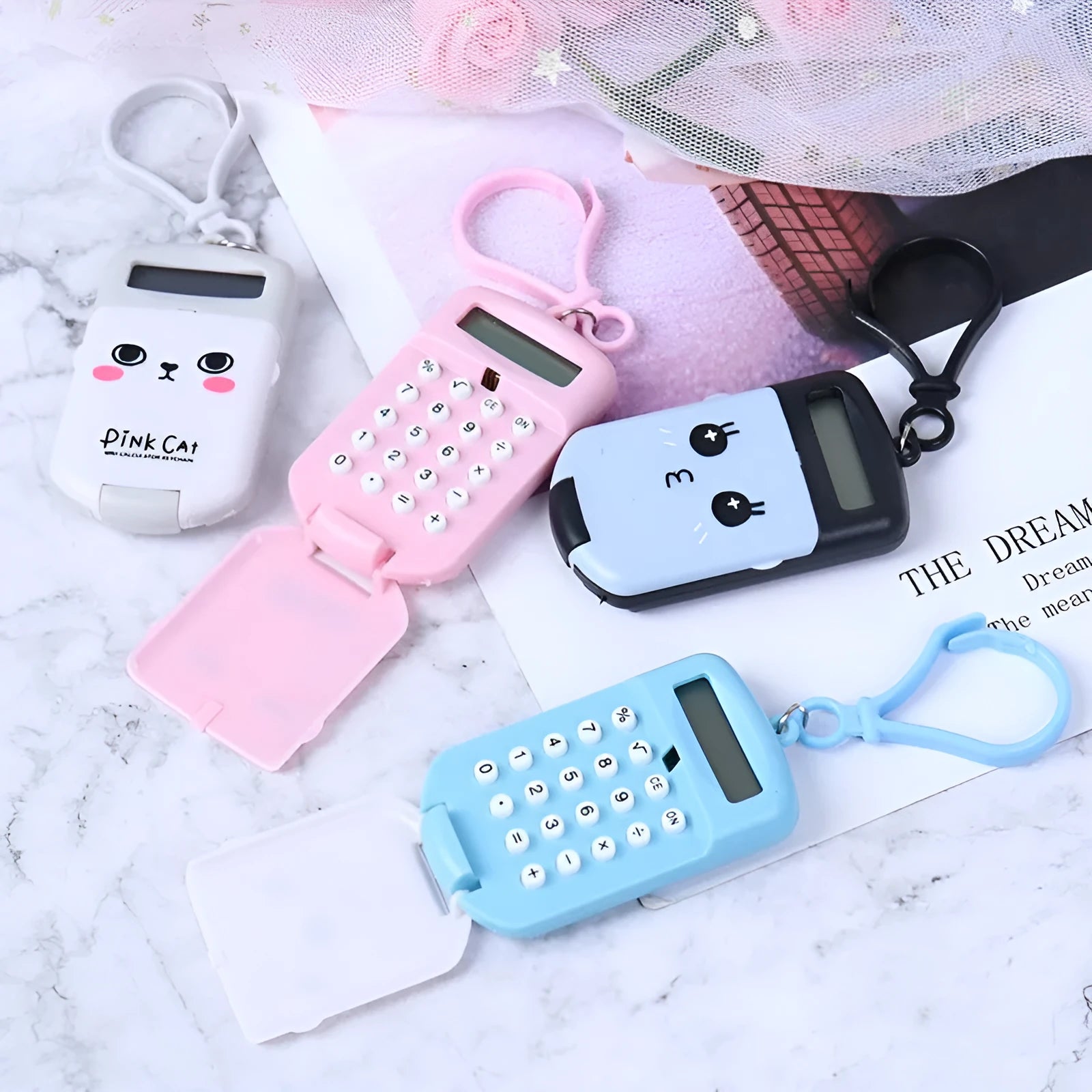 Creative cookie-shaped cute mini calculator with key ring in pink, blue, grey, and black colours