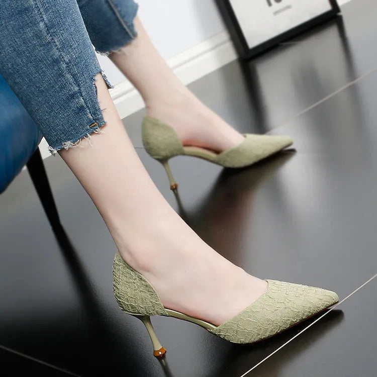 Women's black pointed toe stiletto high heels with a 6-8cm heel on a rubber sole.