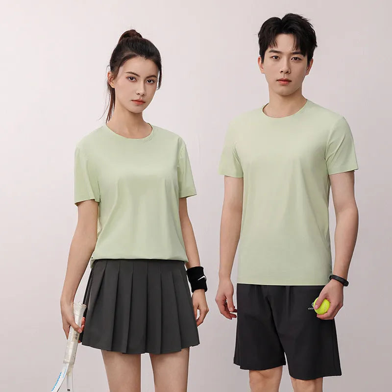 Man wearing a slim fit Ice Silk quick-dry T-shirt in apple green, showing short sleeves and casual style.