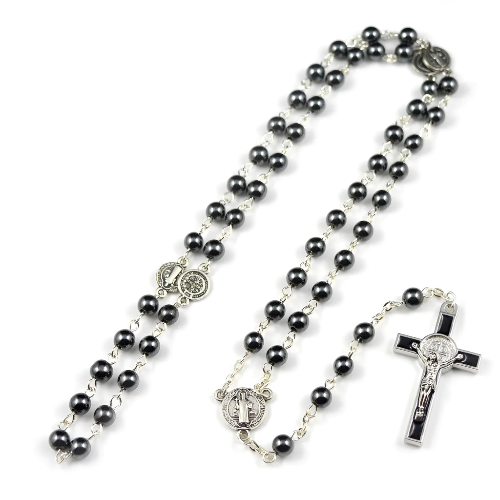 Black hematite rosary necklace with zinc alloy cross and triangle on dark background