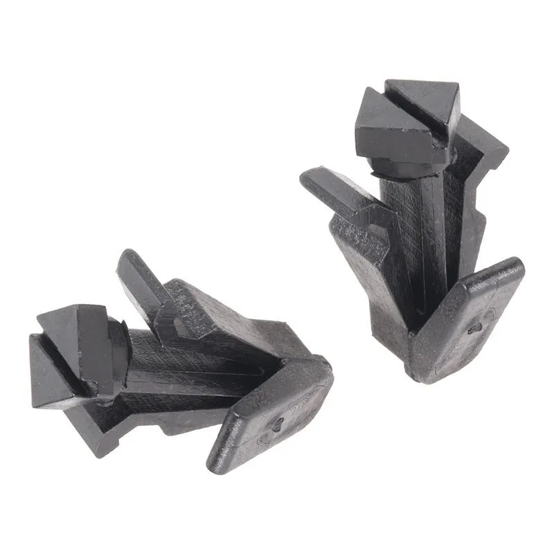 Black plastic Nissan bumper and grille fastening clip, model 76882-0M060.