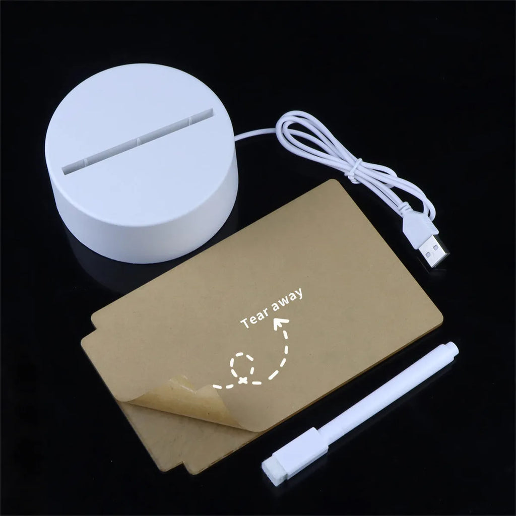 Heart-shaped LED light note board with USB warm yellow glow, base, and pen on a desk