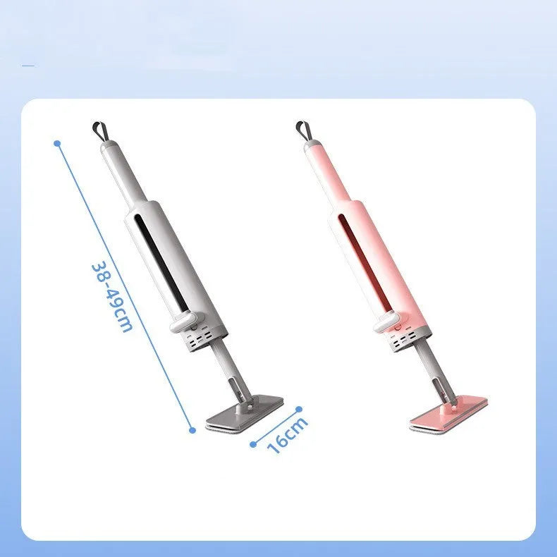 Pink rotatable self-squeeze mini flat mop with microfiber pad, shown extended to its full length.