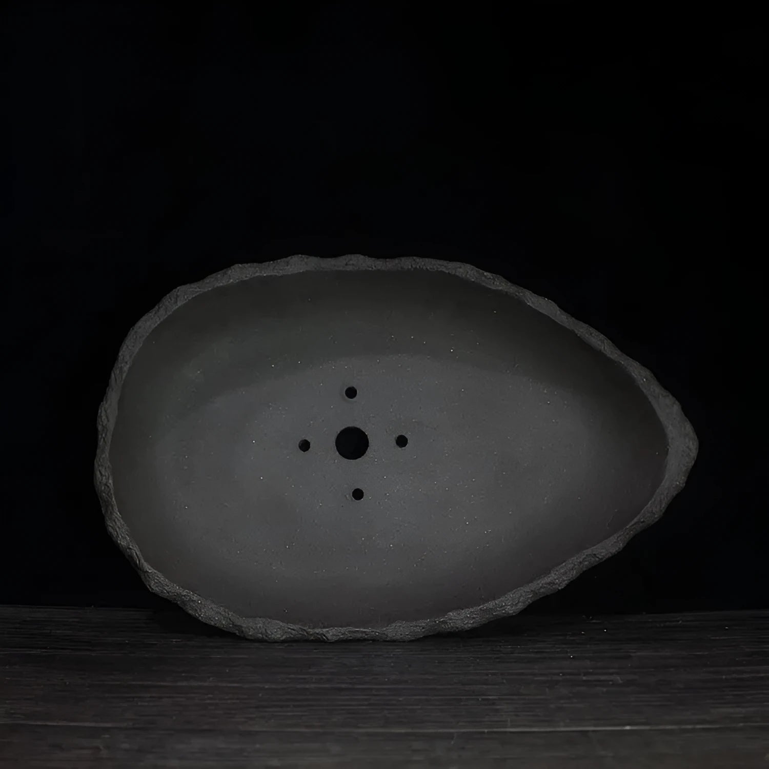 Handmade purple clay flower pot with unique shape for floor-standing plant display