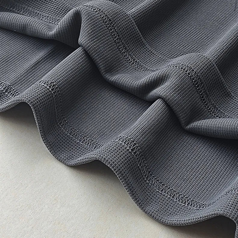 Men's waffle-textured heavy short-sleeved T-shirt in a solid colour, showing detail of fabric texture.